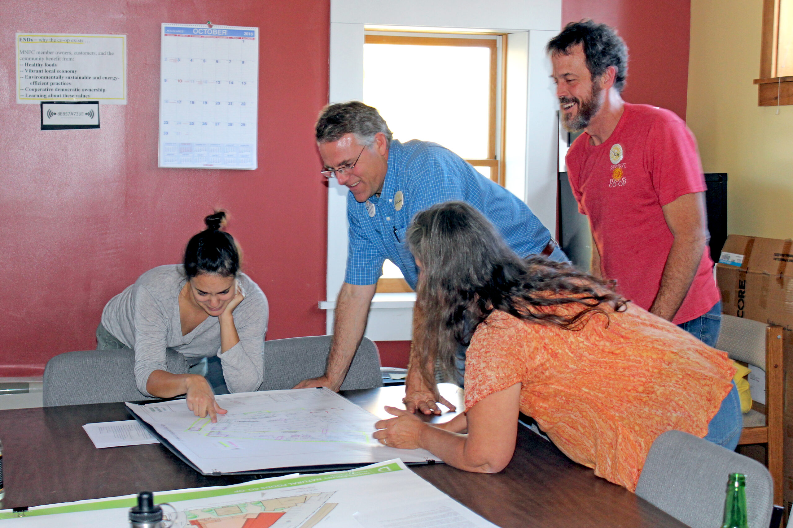 Glenn & staff eagerly checking out the plans