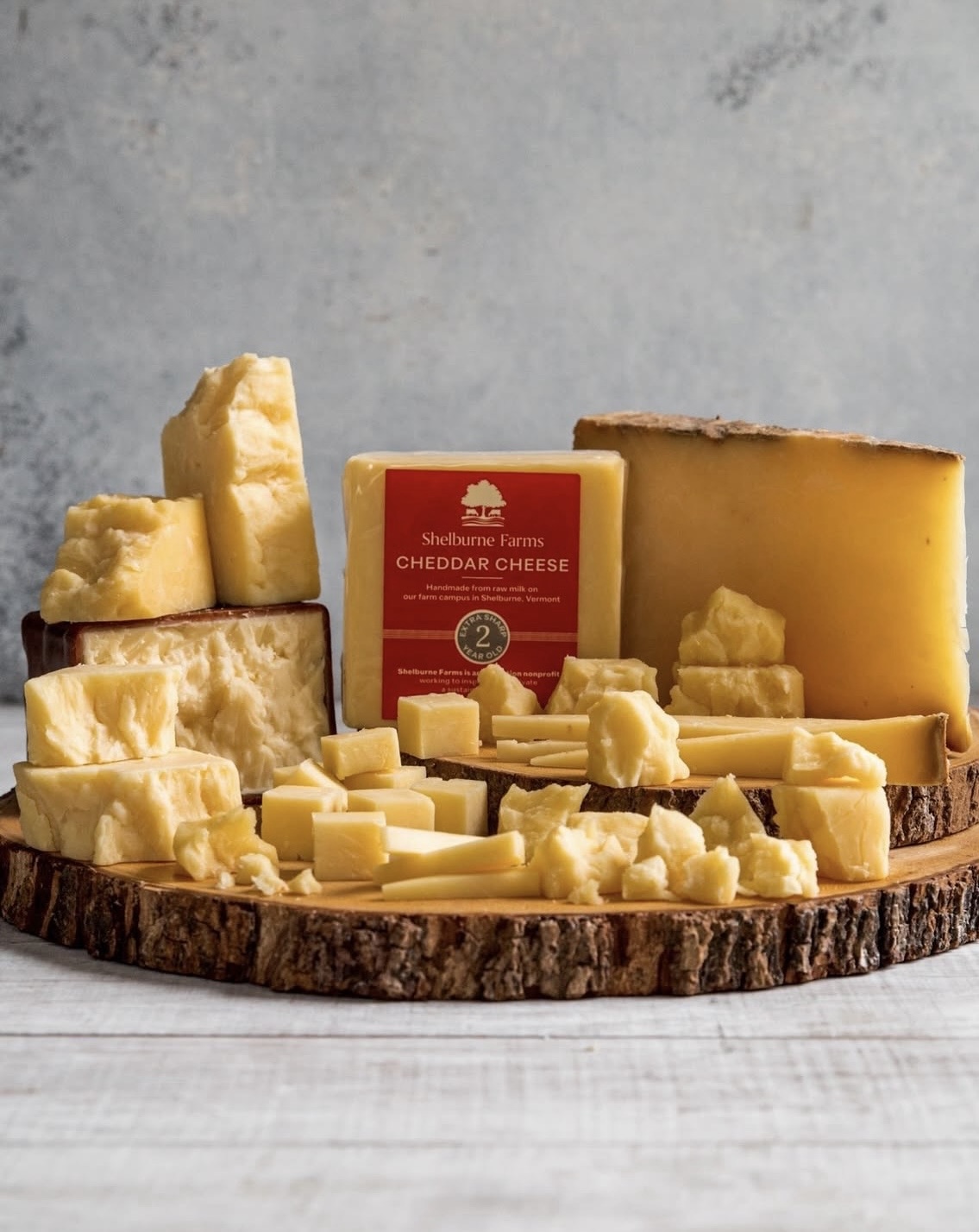 cheddar cheese on a wooden board