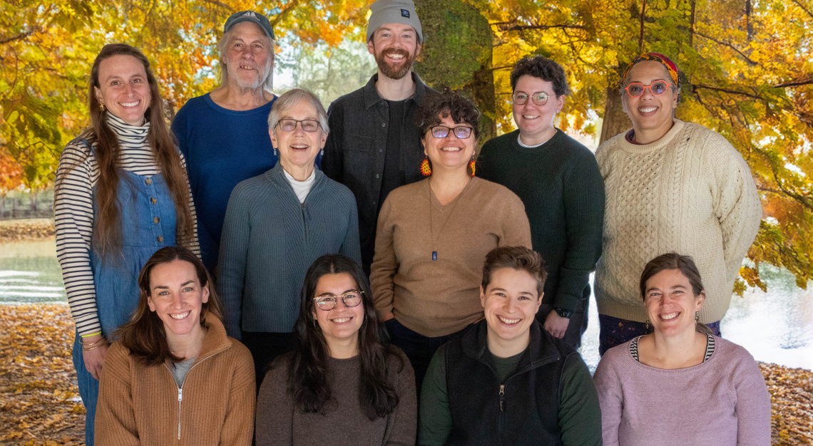 MNFC board in front of fall foliage