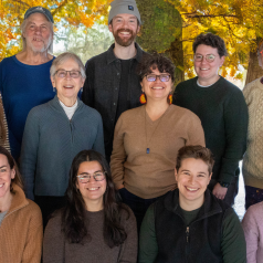 MNFC board in front of fall foliage