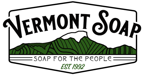 Logo with line drawing of Camel's Hump in background