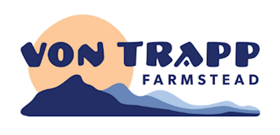 vonTrapp logo with a sun and mountains