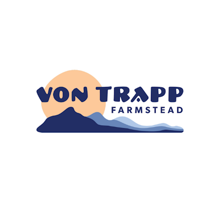 vonTrapp Farmstead logo with a sun and mountains