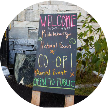 Chalkboard sign inviting poeple to attend the annual meeting