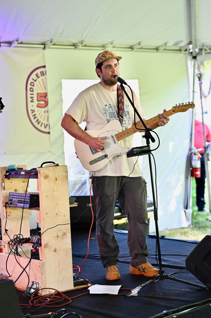 Singer with guitar on stage